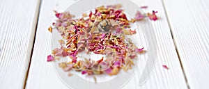 Rose petal tea on white background