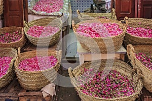 Rose petals in baskets at the souk, Moroccan market in the medina, Fes, Morocco