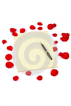 Rose petals and letter paper