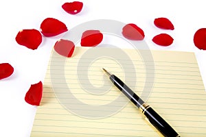 Rose petals and letter paper