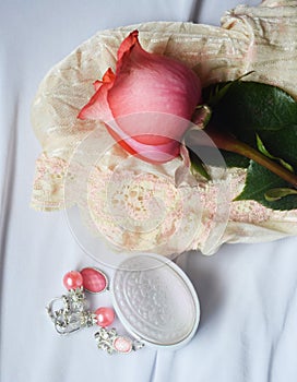 Pink jewelry and rose photo