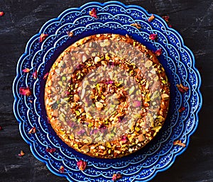 Rose and pistachio cake in turkish blue plate