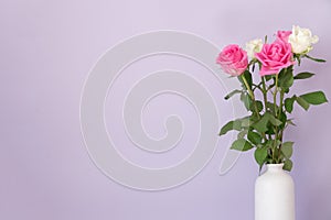 Rose placed on the desk in blue background