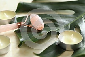 Rose quartz facial massage roller close-up