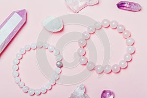 Rose quartz semiprecious bracelet on pink background