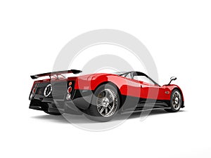 Rose red concept super sports car with black side panels - rear wheel view