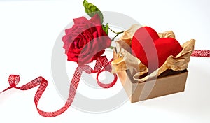 Rose red flower with green leaves stem and small present with ribbon and heart on white background