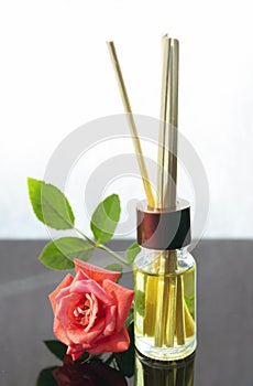 Rose scented oil bottle with wooden sticks