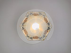 A rose-shaped carved petal-shaped ceiling lamp. up shot.