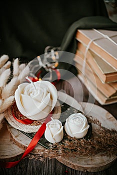 Rose shaped handmade soy wax candle in dark room