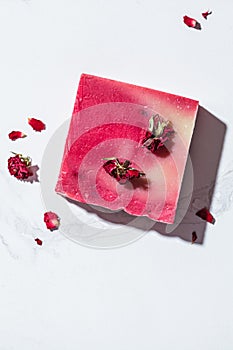 Rose soap on white marble background. Eco cosmetics, natural body care