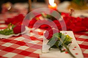Rose on table for romantic dinner photo