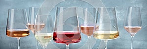 Rose and white wines panorama. Various wine glasses at a tasting at a winery