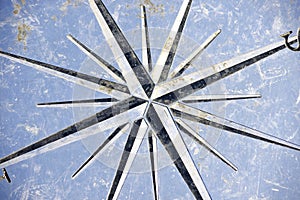 Rose of the winds of the floor of the platform of the viewpoint of the Puente del Petroleo on the beach of Badalona, photo