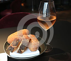 Rose wine and artisian bread served in gourmet restaurant