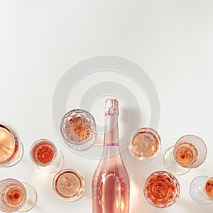 Rose wine assortment in crystal glasses, bottle of rose champagne sparkling wine. Summer alcoholic drink