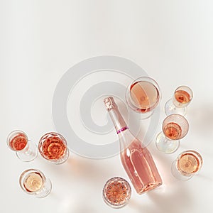 Rose wine assortment in crystal glasses, bottle of rose champagne sparkling wine. Summer alcoholic drink