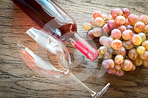 Rose wine with bunch of grape