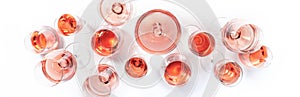 Rose wine glasses on wine tasting. Degustation different varieties of pink wine concept. White background, top view, hard light photo