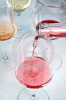 Rose wine poured at a tasting. Various colors of wine. Winetasting