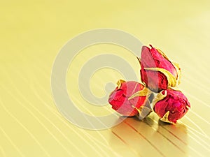 Rosebuds on a golden background photo