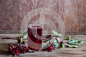 Roselle drink on Wood desk with a books note and repice