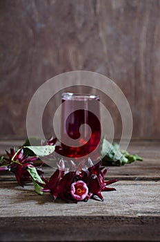 Roselle drink on Wood desk with a books note and repice