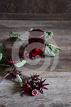 Roselle drink on Wood desk with a books note and repice