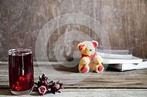 Roselle drink on Wood desk with a books note and repice