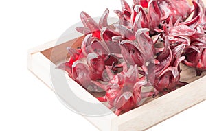 Roselle fruit in wood box isolated