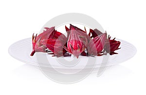 Roselle fruits on plate isolated on white background