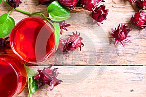 Roselle juice on wooden background, herbal organic tea for good healthy