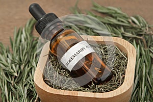 Rosemary herb and aromatherapy essential oil dropper bottle