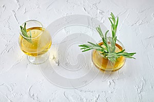 Rosemary and sage herbal tea in glass cups