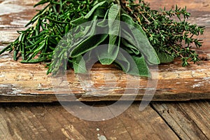 Rosemary, thyme and sage, Herbal Tea on a wooden background, banner, menu, recipe place for text, top view