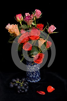 Roses in a blue vase.