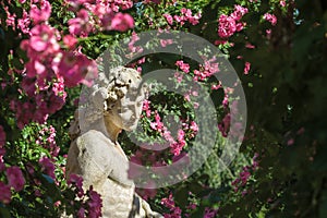 Roses and gods statue in the rose garden Beutig in Baden-Baden