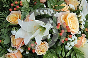 Roses and lillies in a bridal arrangement