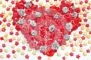 Roses from paper dacorated in hearth shape and star background