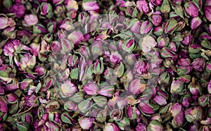 Roses pink, dried on heap. Antioxidant and healthy rosebuds for background. Close up view.