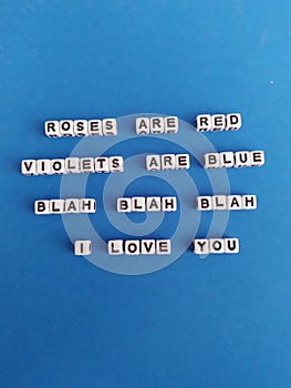 Roses are red violets are blue blah blah blah I love you poem on a blue background for valentine's day