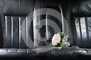 Roses at seat of newlywed limo