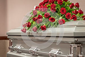 Roses on Top of Funeral Casket photo