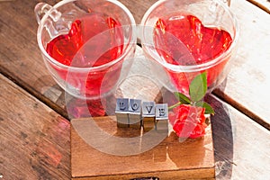 Roses for Valentine , red water in heart cup and love message