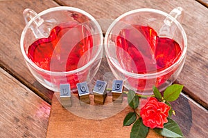 Roses for Valentine , red water in heart cup and love message