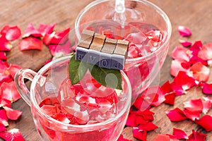 Roses for Valentine , red water in heart cup and love message