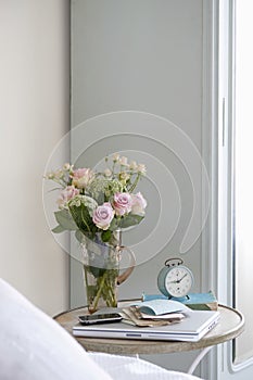 Roses In Vase On Bedside Table