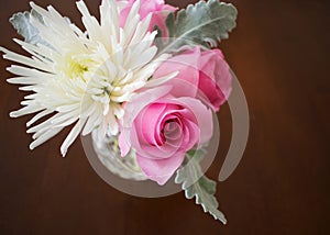 Roses and white chrysanthemum in vase