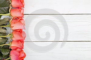 Roses on a wooden surface