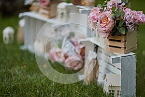 Roses in wooden white boxes for wedding decoration